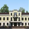 Фасад двухэтажного административного здания с балконом, украшенным ажурной решеткой